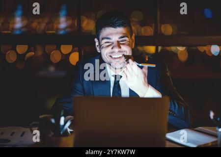 Office Manager Guy Using Voice Assistant On Smartphone In Office Stock Photo