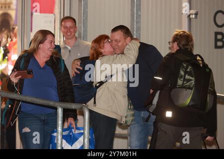 CEO of Villa Vie Residences Mikael Petterson get a kiss from a passenger as they prepare to board the Villa Vie Odyssey cruise ship at Belfast Port's Cruise Ship Terminal, after the luxury cruise ship became marooned in Belfast for four months due to unexpected repair works. Picture date: Monday September 30, 2024. Stock Photo