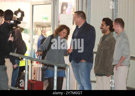 CEO of Villa Vie Residences Mikael Petterson (3rd right)with passengers as they board the Villa Vie Odyssey cruise ship at Belfast Port's Cruise Ship Terminal, after the luxury cruise ship became marooned in Belfast for four months due to unexpected repair works. Picture date: Monday September 30, 2024. Stock Photo