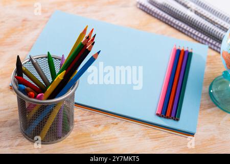 Colored pencils kept in pencil holder Stock Photo