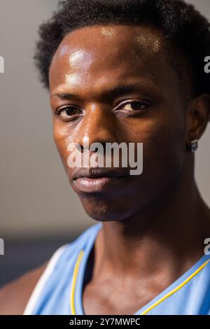 Close-up of African American Basketball player in jersey, looking determined and focused Stock Photo