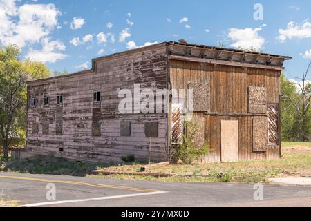 An old, abandoned two story wooden building in Ash Fork, Arizona, USA Stock Photo