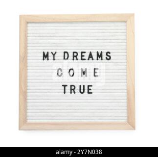 Letter board with phrase My dreams come true on white background, top view Stock Photo