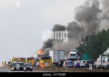 Firefighters respond to a fire on US 295, east of Richmond. A fire shutdown traffic during morning rush hour east of Richmond, VA on Monday morning. At approximately 8:15 a.m. Virginia State Police responded to northbound Interstate 295 on the Varina-Enon Bridge for a tractor-trailer that caught fire. After initial investigation, it was found that the truck struck the bridge on the right hand side before catching fire. It was hauling paper products, The driver was not injured and charges remain pending. This crash remains under investigation.' (Photo by Jen Golbeck/SOPA Images/Sipa USA) Stock Photo