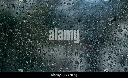 Rain drops on window glass , Wet window with rainy drops , Blurry , texture Stock Photo