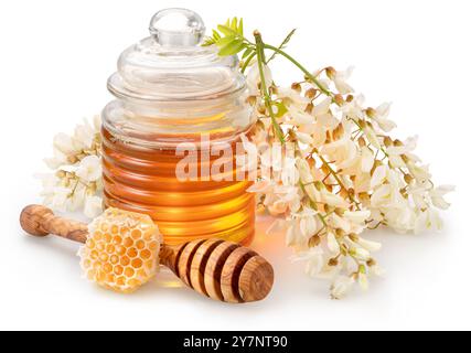 Cluster of blooming acacia flowers and glass jar of honey isolated on white background. Stock Photo