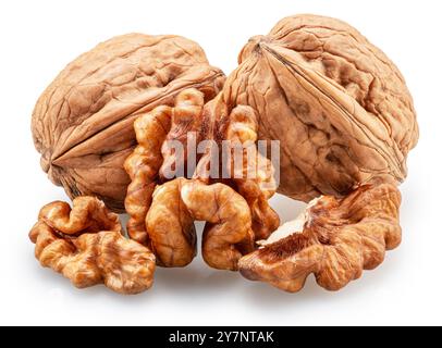 Whole walnuts, broken walnut with kernel and green leaves isolated on white background. Clipping path. Stock Photo