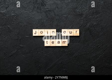 join our team word written on wood block. join our team text on table, concept. Stock Photo