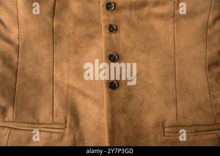 Womens light brown artificial suede vest textured background. Slow fashion concept Stock Photo