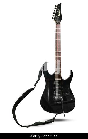 Izmir, Turkey - Jun 20 2024: Front view of an Ibanez Prestige electric guitar photographed on a white background, featuring its sleek black body, wood Stock Photo