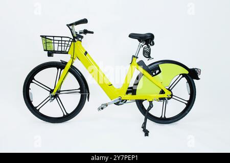 New yellow electric scooter isolated on white. City Bike of rental system Stock Photo
