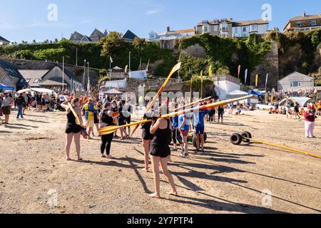 Pilot Gig crews carrying their oars waiting to board their Pilot Gigs for Women's Newquay County Championships Cornish Pilot Gig Rowing event at Newqu Stock Photo