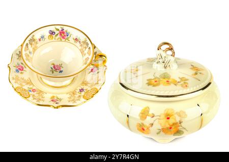 Vintage porcelain tableware: coffee cup with saucer and elegant candy bowl isolated on white background. Collage. Stock Photo