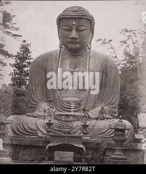 Vintage photo of Dai Bouts At Kamakura (The Great Buddha of Kamakura). Kamakura, Kanagawa prefecture. Japan. 1863–1868. By Felice Beato  A massive bronze statue of a Great Buddha (Daibutsu) at the temple of Kotoku-in. Two men sit at the base of the statute, another stands by the stone pedestal. Stock Photo