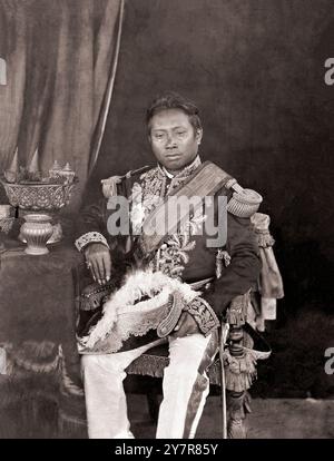 Norodom of Cambodia in European naval uniform. 1865. By J. Thompson Norodom (1834–1904) was King of Cambodia. He was the eldest son of King Ang Duong and was a half-brother of Prince Si Votha and King Sisowath. He was elected to the throne in 1860 but would not be crowned until 1864 because Siam held the royal regalia (the royal crown and other artifacts). In 1863, he signed a treaty with France by giving France control over Cambodia's foreign relations in exchange for personal protection against his enemies. The treaty saved Cambodian independence, but French control over Cambodia's internal Stock Photo