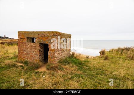 WW2 lookout pill box above the beach at Happisburgh, Norfolk, England. Stock Photo