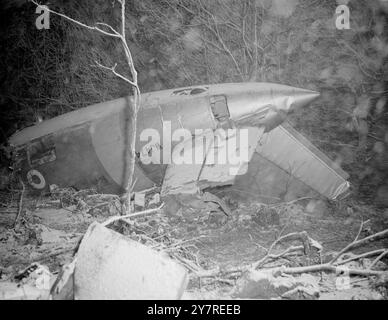 RAF TRANSPORT PLANE CRASHES IN SNOW BLIZZARD. 20 CARRYING RUGBY TEAM. 6.1.54. An RAF Valetta transport plane this afternoon took off from Bovingdon, Herts, to return to its base at Thorney Island. It crashed a few minutes after takeoff. Apart from the crew, there were members of an RAF rugby team aboard the doomed aircraft. It crashed into some wooded, snow-bound country at Toms Hill, Ashridge Park, Tring, Herts. Soon rescue teams and ambulance crews were on the spot, but they were being blinded by the driving winds and snow. Fifteen of the occupants are now dead, and the lone survivor is in t Stock Photo