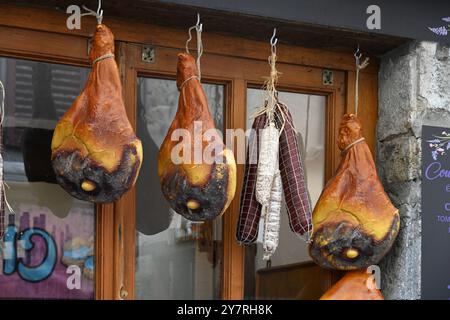 Display of Preserved Cold Meat Saucisson & Ham or Hams Hanging Up Outside Shop or Butcher in Castellane Alpes-de-Haute-Provence Provence France Stock Photo