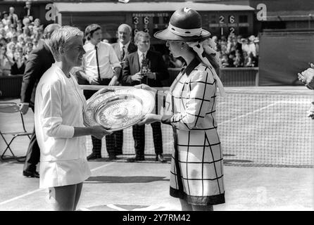 ANN JONES WINS WIMBLEDON TITLEWIMBLEDON, ENGLAND, UK : It's been a long wait, but after thirteen years of effort, Mrs Ann Jones collects the Ladies' Singles Championship trophy at Wimbledon from Princess Anne, on Centre Court here this afternoon, following her surprise victory over the defending champion and No 2 seed Mrs Billie-Jean King. A 15000 capacity crowd gave the girl from Birmingham, England a great ovation at the end 3-6, 6-3, 6-2 win. 4 July 1969 Stock Photo