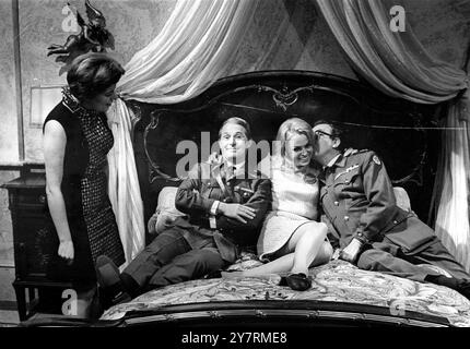 HAPPY SANDWICHBuckinghamshire, England, UK : Miss Germany, Jutta Danske is pictured sandwiched between Ernie Wise (left) and Eric Morecambe as Miss Germany’s chaperone, Verity Reily-Collins looks on when Miss Germany visited the studios where Britain’s famous Morecambe and Wise comedy team are currently filming The Magnificent Two, today, November 10, 1966.  She is here for the November 17, 1966 Miss World contest. 10 November 1966 Stock Photo