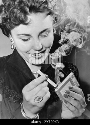 self lighting cigarette match Black and White Stock Photos & Images LIVE] Recreating a Forgotten 1950s