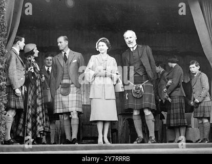 LORD CARNEGIE WITH ROYAL FAMILY AT 1952 HIGHLAND GAMES The Queen and the Duke of Edinburgh were present at the opening of the Highland Games at Braemer on 4th September, 1952. The Duke of Edinburgh wore a kilt. Photo shows At the Highland Games at Braemar. Left to right: Lord Carnegie, Mrs Farquharson of Invercauld, the Duke of Edinburgh, the Queen, the Marquis of Aberdeen and in background the Duke of Kent, Princess Margaret and Prince Michael of Gloucester.  4 September 1952 Stock Photo