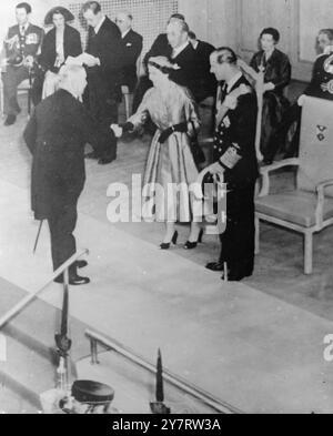 QUEEN AT WHITLA HALL. 2.7.53. The Queen, standing with the Duke of Edinburgh, receiving guests when she attended the Whitla Hall, Belfast to receive loyal addresses. Immediately behind the Queen is Viscount Brookeborough, Prime Minister of Northern Ireland. In the extreme left hand top corner is Group Captain Peter Townsend an intimate friend of the Royal Family. When this photograph was being taken there was an explosion believed to be caused by an Irish Republican Army bomb, which damaged a railway bridge near the Eire- Northern Ireland border today.   2 July 1953 Stock Photo