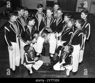 Tht Tooting sailors rehearse their hornpipe. - - Pictured in old-time sailors' costume at Cecil Sharp House , Regent's Park Road , London NW , are Tooting and Balham Sea Cadets who were rehearsing their sailor's hornpipe for the Jubilee Folk Dance and Song Festival of the English Folk Dance and Song Society. Seated on the capstan is Leading-Seaman John Piggott . The Festival takes place ay the Royal Albert Hall on Friday and Saturday 10 and 11 January 1958 - - - - 8 January 1958 Stock Photo