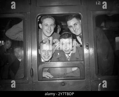 ENGLAND VS GERMANY AT SOCCER 20 April 1950  Led by Johnny Haynes, the outstanding footballer for England in the schoolboys soccer international, a party of 18 youngsters left Victoria Station, London today (Thursday) to make a ten day tour of Germany. They will play against German school teams in Cologne, Frankfort, Mainz and Dusseldorf, returning to Britain on May 1st. Pictrue Shows: Four of the British schoolboys team, all members of the England schoolboys international XI, shown in the window of their train at Victoria Station today. Bottom Row, Fred Cooper (left) and Johnny Haynes, Top Row Stock Photo