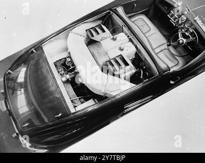 TURBO CARS WORKS 13 April 1950  This is the first picture to be made public showing the engine arrangement of the experimental gas turbine car demonstrated recently at the Silverstone Circuit by the Rover Company Ltd of Birmingham. This view of the engine compartment with the cover removed was taken shortly before a transparent cover was fixed in readiness for the cars appearance at the British Motor Show opening in New York on April 15. The starter motor can be seen protruding at the extreme rear of the engine, and towards the front of the engine (behind the drivers seat) can be seen the two Stock Photo