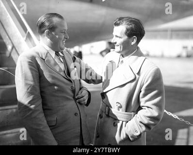 NEW AUSTRALIAN CHALLENGER RECEIVES A GOLFERS WELCOME 12  April 1950  Australian golfer Ossie Pickworth (left) greeted by Dai Rees, British professional match play champion, at London Airport today (Wednesday). Pickworth has come to Britain from Melbourne with hopes of winning the British Open title.  Next week he is to play in the Silver King tournament, first big professional competition of the season.  Pickworth learnt the game while caddying for Walter Hagen and other leading American players when they toured Australia.  He started playing when he was 12 and won his first tournament victory Stock Photo