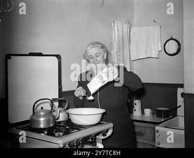 FROM KITCHEN TO MAYOR'S PARLOUR29 March 1950  Housewife who will be as much at home in this Mayor's parlour as she is in her own kitchen is Mrs Jacquette Marshall, a widow who has been chosen as Plymouth 's first woman Lord Mayor.  Mrs Marshall is pictured as she cooks the dinner at her Plymouth home, where she lives alone.  She is used to establishing precedents, twenty five years ago she was the first woman to sit on the Council. Stock Photo