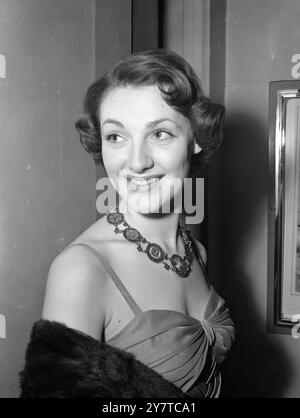 Neckless of the enamelled coins worn by film actress Barbara Murray when she attended the premiere of ' They Were Not Divided ' , new British film about a unit of the Guards Armoured Division , at the Leicester Square Theatre , London.  30 March 1950 Stock Photo