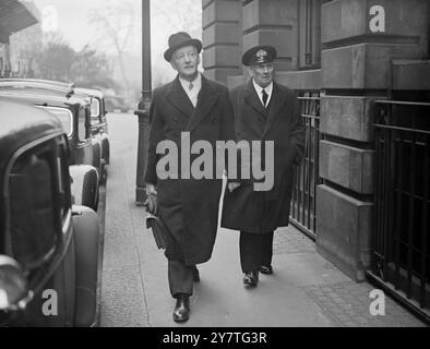 AT ' TRUCULENT ' INQUIRY IN LONDON TODAY   The pilot who was on the bridge of the Swedish motor ship  ' Divina ' at the time of the collision with the British submarine ' Truculent ' in the Thames estuary arrives with his solicitor, Mr. D. Howe H. Farnfield for the Swedish Maritime enquiry at Trinity house, Trinity square, London.  25 January 1950 Stock Photo