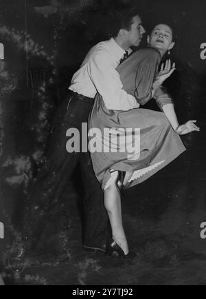 Melissa Hayden and Nicholas Magallanes, two members of the New York City Ballet Company, hold an informal rehearsal at their London hotel shortly after their arrival in this country. The Company will be appearing in Covent Garden, London, England.5 July 1950 Stock Photo