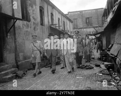 Viceroy views scenes of ruins in CalcuttaField Marshal Lord Wavell , Viceroy of India , flew from Delhi to Calcutta and made an extensive tour of the city to acquaint himself with the situation , following the bloody riots in which numbers of people were killed.  Photo shows:  The Viceroy , Lord Wavell ( light suit) walking through a Muslim market in Calcutta , where more than forty bodies were found , during his tour of the city .  With him, in civilian clothes  and wearing a dark hat is the Governor of Bengal, Sir Frederick Burrows  26 September 1946 Stock Photo