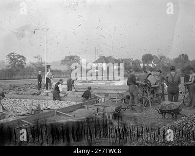 GERMAN PRISONERS WORK ON MOTTINGHAM HOUSING ESTATE German prisoners of war are being used to lay drains and prepare the site of a new pre-fabricated housing estate at Mottingham, kent.  The British building trades have been protesting against this use of German man power, but in view of the urgency of the housing problem and the shortage of Briotish workers available, the authorities have seen fit to make German ex servicemen rebuild something of what they had destroyed in the war.  17 October 1945 Stock Photo