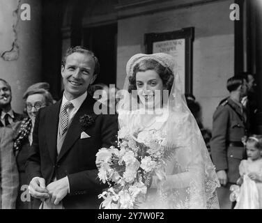 'LADDIE' LUCAS FAMOUS BATTLE OF BRITAIN PILOT, MARRIES IN LONDON. Wing Commander PB ('Laddie') Lucas DSO, DFC amd Bar, was married at Grosvenor chapel, South Audley Street, London to Miss Jill Dorren Addison, daughter of Lieutenant Colonel and Mrs A M Addison of Ascot.  the brides sister is married to that other famous Battle of Britain Pilot, Group Captain Douglas Bader, DSO and Bar, who is a firm friend of Lucas. Photo shows: The bride and bridegroom leaving Grosvenor chapel, London after the ceremony. 22 May 1946 Stock Photo