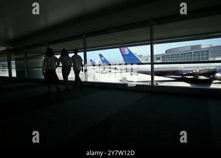 San Francisco, Calif.,-  United AIrlines aircraft are parked at gates at the San Francisco Airport's new international terminal. United Airlines the second largest airline in the world files for bankruptcy protection in Chicago.  San Francisco International AIrport is heavily depended on United AIrline which brings in  51 percent of the passenger and 27 percent of annual revenue to the airport.  Photo taken on May 15, 2002. Stock Photo