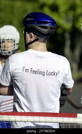 Matt Cutts, a software engineer at Google, playing roller blade hockey in the company parking lot. Google is promoting a healthier lifestyle by having weekly hockey games and by serving healthier food in the company cafeteria. Mountain View, CA. May 3, 2001. Stock Photo