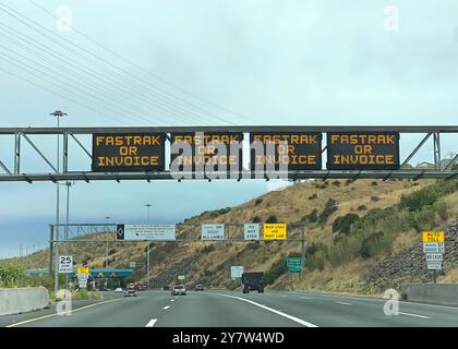Crocket, CA - July 14, 2024: View of toll signs on the north bound section of the Carquinez Bridge just before the toll booths. Stock Photo