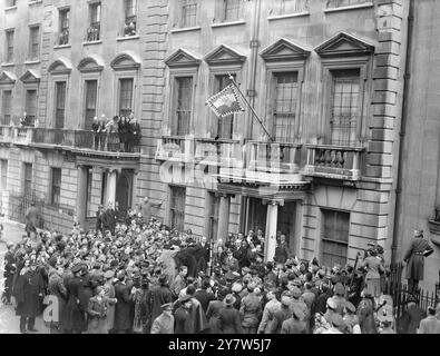 EXILED KING OF YUGOSLAVIA MARRIES PRINCESS ALEXANDRA OF GREECE IN LONODN. The King and Queen and representatives of other Royal Houses in Europe were present when King Peter II of Yugoslavia and Princess Alexandra of Greece were married at the Yugoslav Embassy in London.  the ceremony was conducted by Arch Priest Z Ristanovitch, who represents the Serbian Orthodox Church in this country.  Photo Shows: A general view showing the King Peter with his bride, leaving the Yugoslav Embassy after the royal wedding.  20 March 1944 Stock Photo