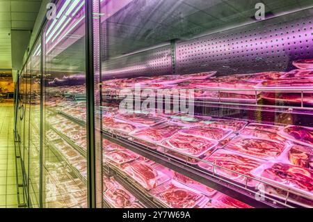 meat section display refrigerators in a supermarket Stock Photo