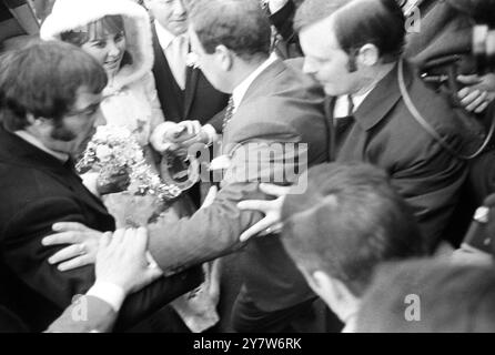 Pop singer Lulu's bridesmaid and four young attendants after the singer's wedding to Maurice Gibb of the Bee Gees group at St James's church here today, Gerrards Cross, Buckinghamshire, England. Seen here Lulu making her way through the crowds of fans and newsmen. 18 February 1969 Stock Photo