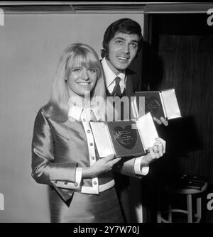 With their hearts in their hands, it's a proud moment for these two youngsters of show business. Actress Carol White voted the most promising star of 1967, for her performance in the film 'Poor Cow', and pop singer Engelbert Humperdinck voted show business personality of the year, received their awards at the Variety Club of Great Britain luncheon today at the Savoy Hotel, London, England.12 March 1968 Stock Photo