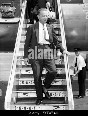 Mr Dag Hammarskjoeld, Secretary General of the United Nations, leaves his plane on arrival at London Airport today (Wednesday) from New York en route to the Lebanon for talks with UN military observers.The observers were sent following Lebanese charges of 'massive interference' by Egypt and Syria. 18 June 1958 Stock Photo