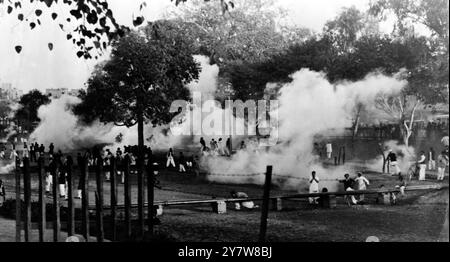 The Moslem League have been holding meetings of defiance in Lahore. Leaders marched towards the Secretariat and when these pictures were taken Begum Shah Nawaz and ex Minister Shaukat Hyat Khan who had been recently released, were arrested a second time. There were 62 arrests. Moslem women, mostly in Purdah, took part in the defiance demonstrations and tear gas was used to disperse the crowds.Seen here tear gas used to drive away the Moslem crowds outside Delhi Gate Lahore. (Original caption) 8 February 1947 Stock Photo