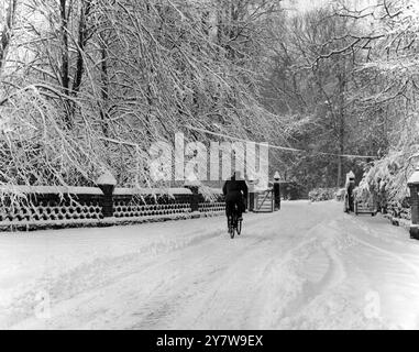 A man cycling through the snow in Chevening , Kent , England .3 February 1962 Stock Photo