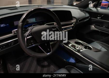 modern and stylish interior Cadillac Lyriq, steering wheel premium electric SUV, brand’s advanced technology in Europe, automotive industry, Frankfurt Stock Photo