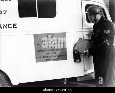 Home Front 1940 - This ambulance was presented to the London County Council ( LCC ) Civil Defence by HM King George VI as it reads on the plaque on the side of the van Stock Photo